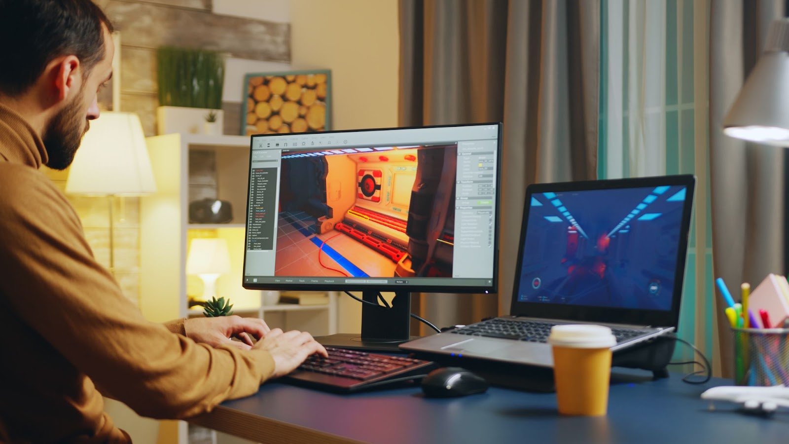 Man working on animation on two computers