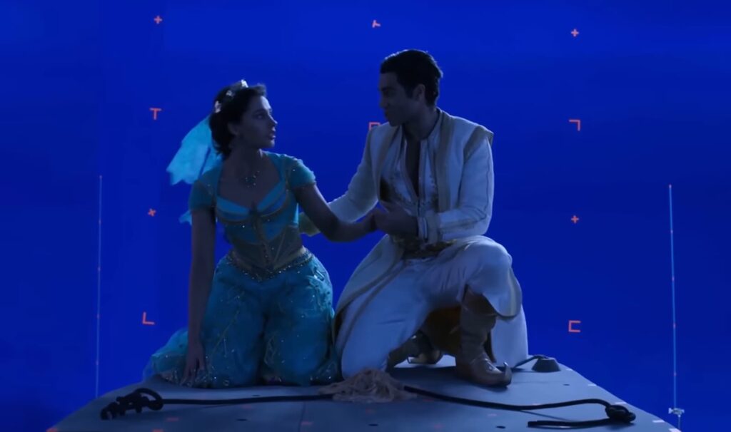 Actors on a magic carpet in a blue screen studio